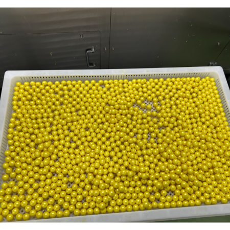 Yellow paintballs in paintball drying tray